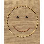 Le Smiley dans le sable
